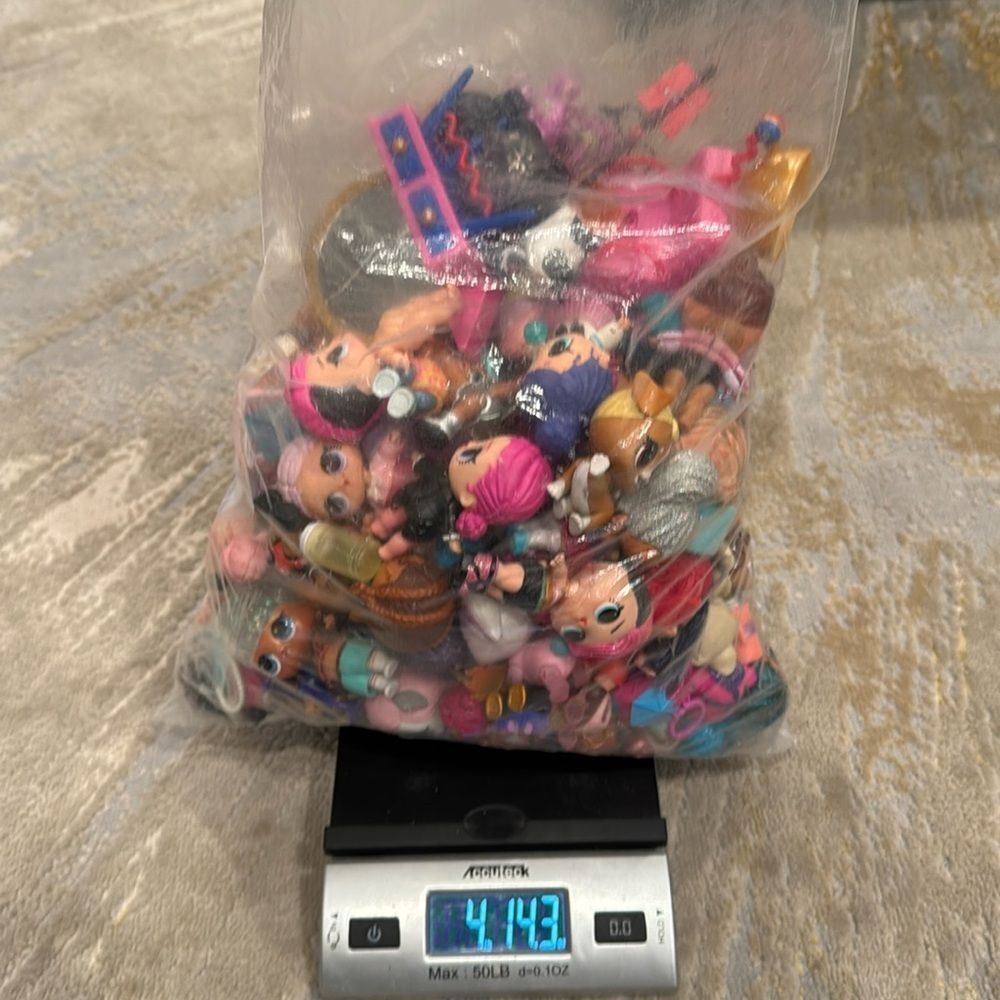 Almost 5lb of Lol dolls , dolls accessories , clothes and some furniture big lot